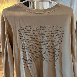 Sofia with an F crewneck sweatshirt